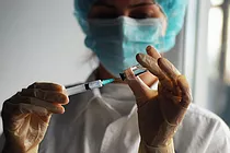 Clinician preparing vaccine